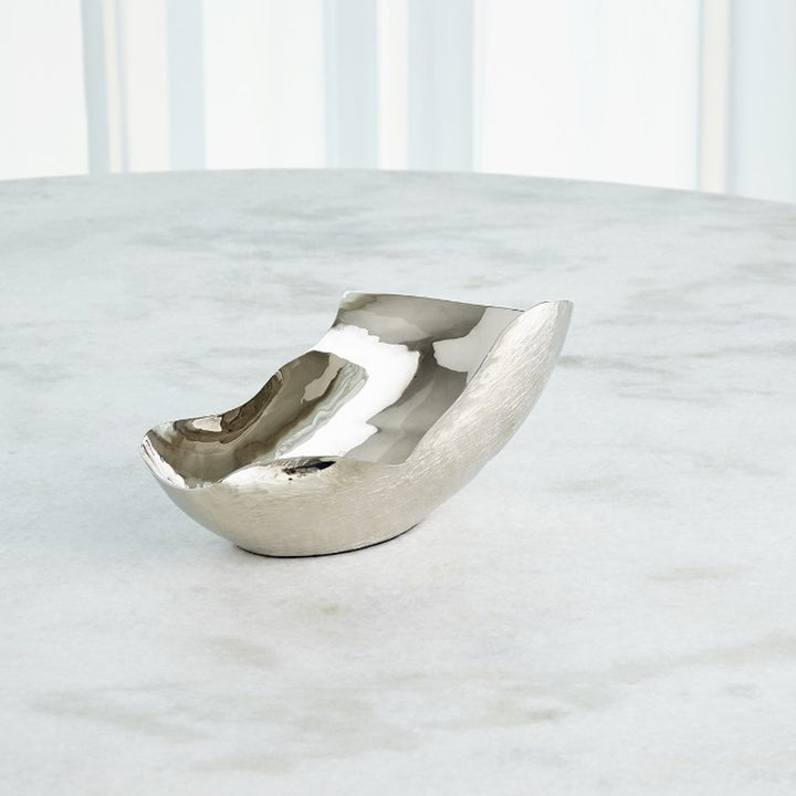 Silver bowl with a unique design on a white background. Decorative Bowl Delgado District Home