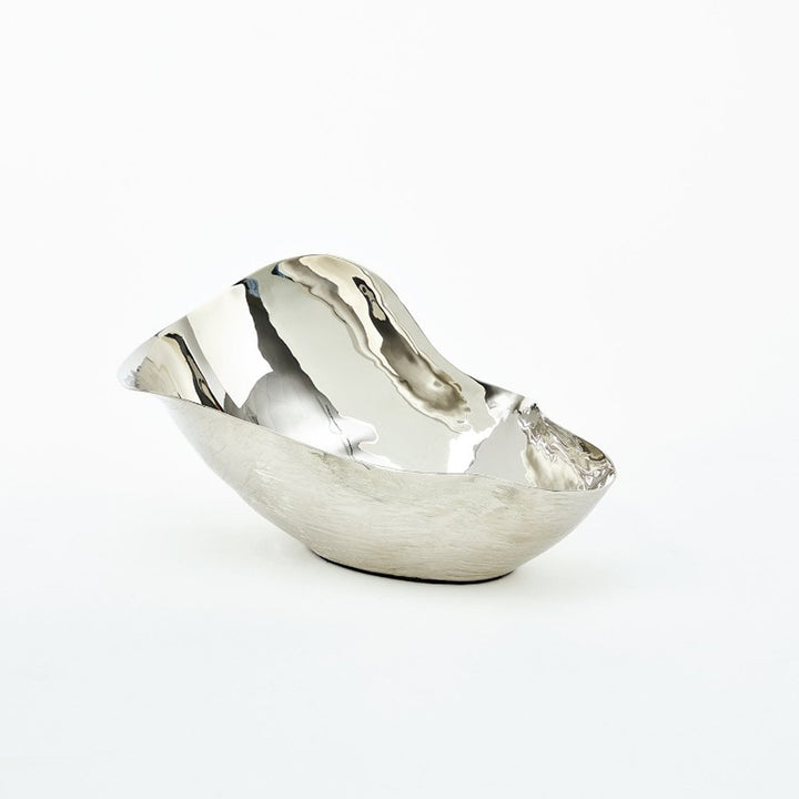 Silver bowl with a unique design on a white background. Decorative Bowl Delgado District Home