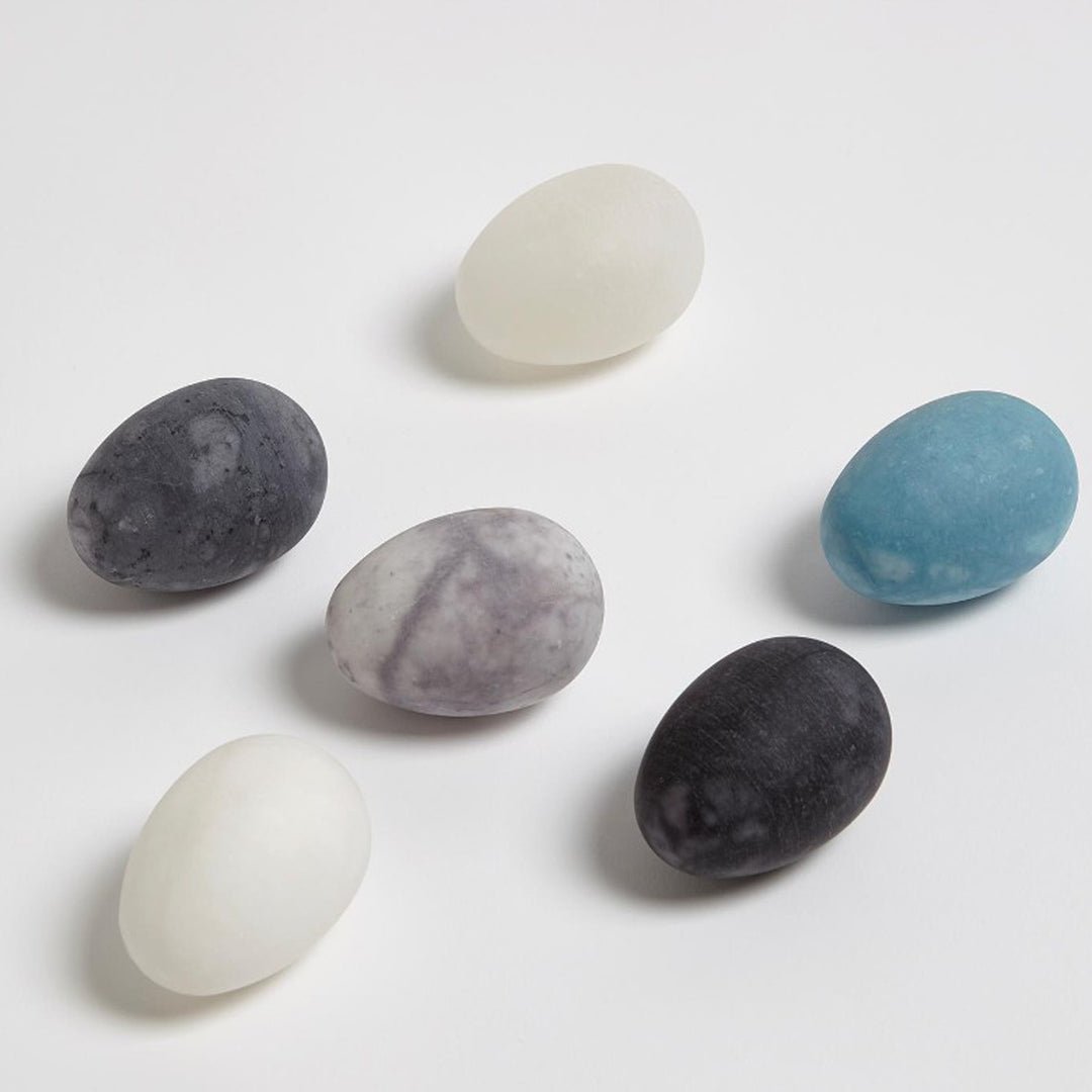 Set of six marbled stones in various colors on a light gray background. Set of 6 Assorted Alabaster Eggs District Home