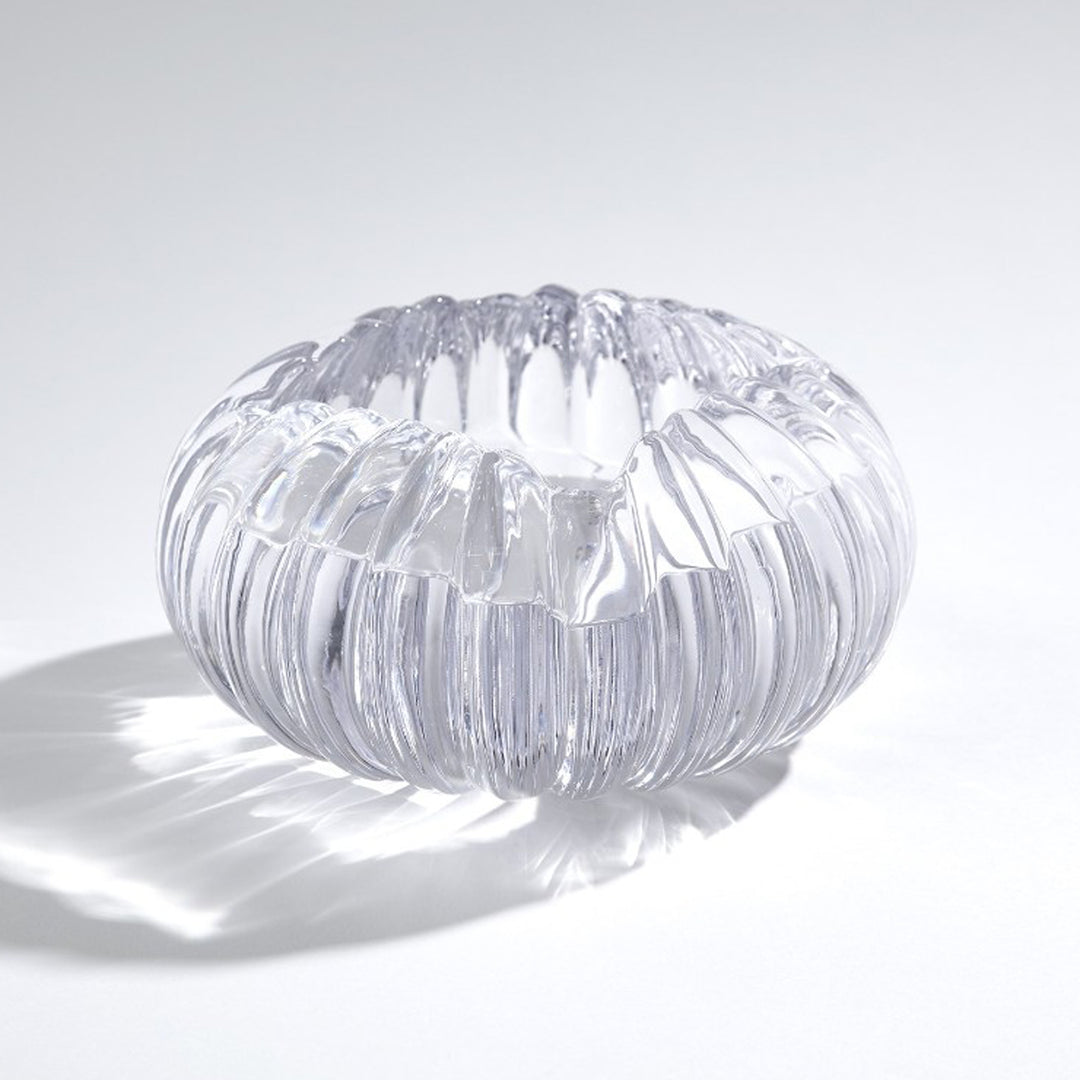 Clear glass bowl with ribbed texture on a white background. Decorative Bowl Elmira District Home