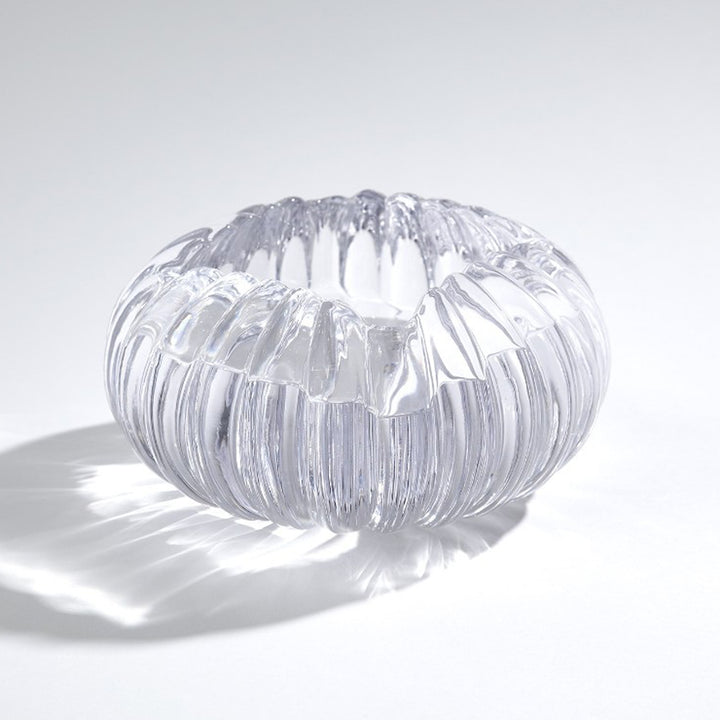 Clear glass bowl with ribbed texture on a white background. Decorative Bowl Elmira District Home