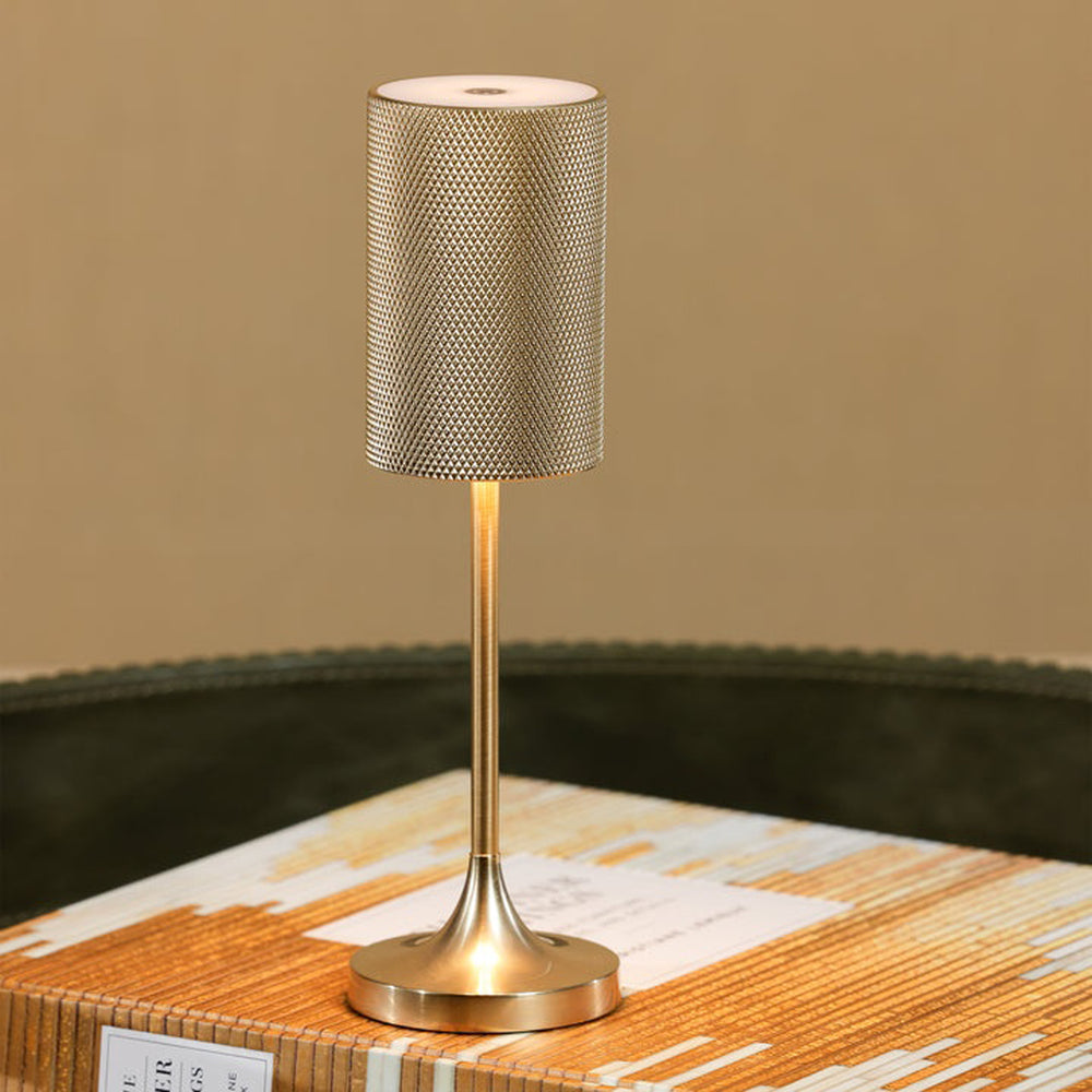 Small table lamp with textured shade on a wooden surface Rechargeable Table Lamp Facett District Home