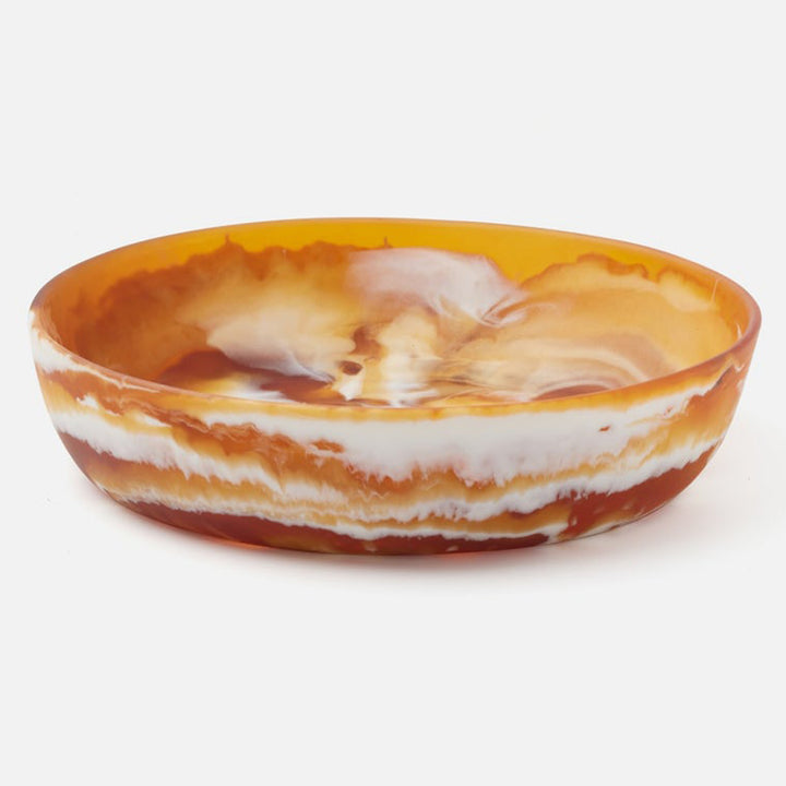 Decorative bowl with orange and white marbled pattern on a white background District Home