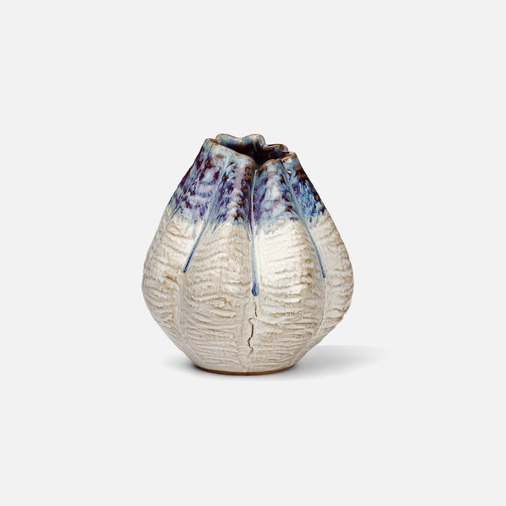 Ceramic vase with textured surface and blue accents on a white background. Ceramic Vase Miadana by District Home