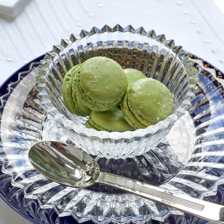 Clear glass bowl with fluted design on a white background Baccarat Mille Nuits Small Bowl District Home