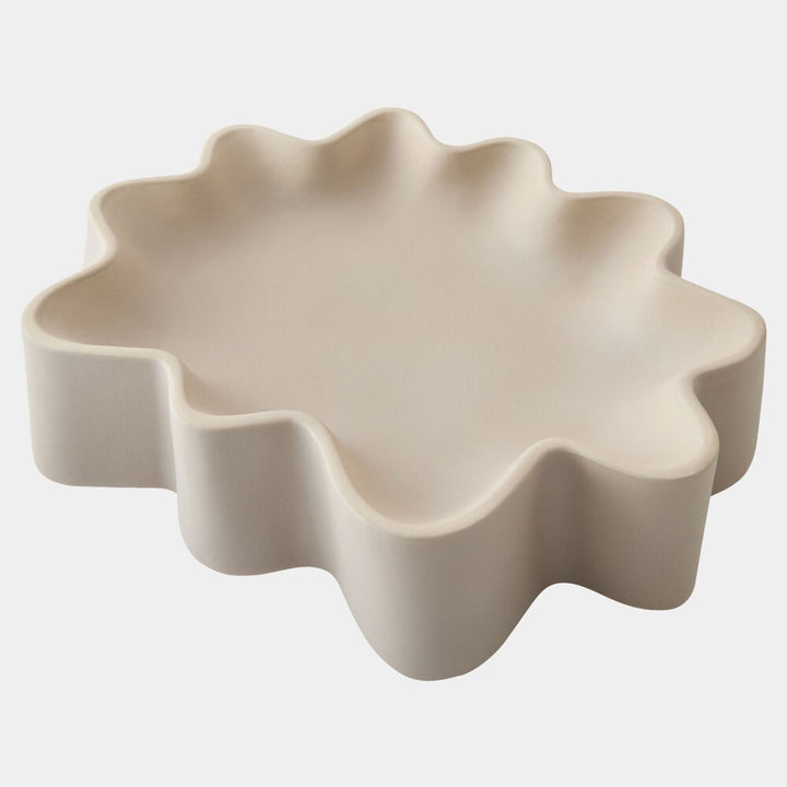 Beige ceramic dish with wavy边缘 on a white background. Decorative Bowl Ochre G by District Home