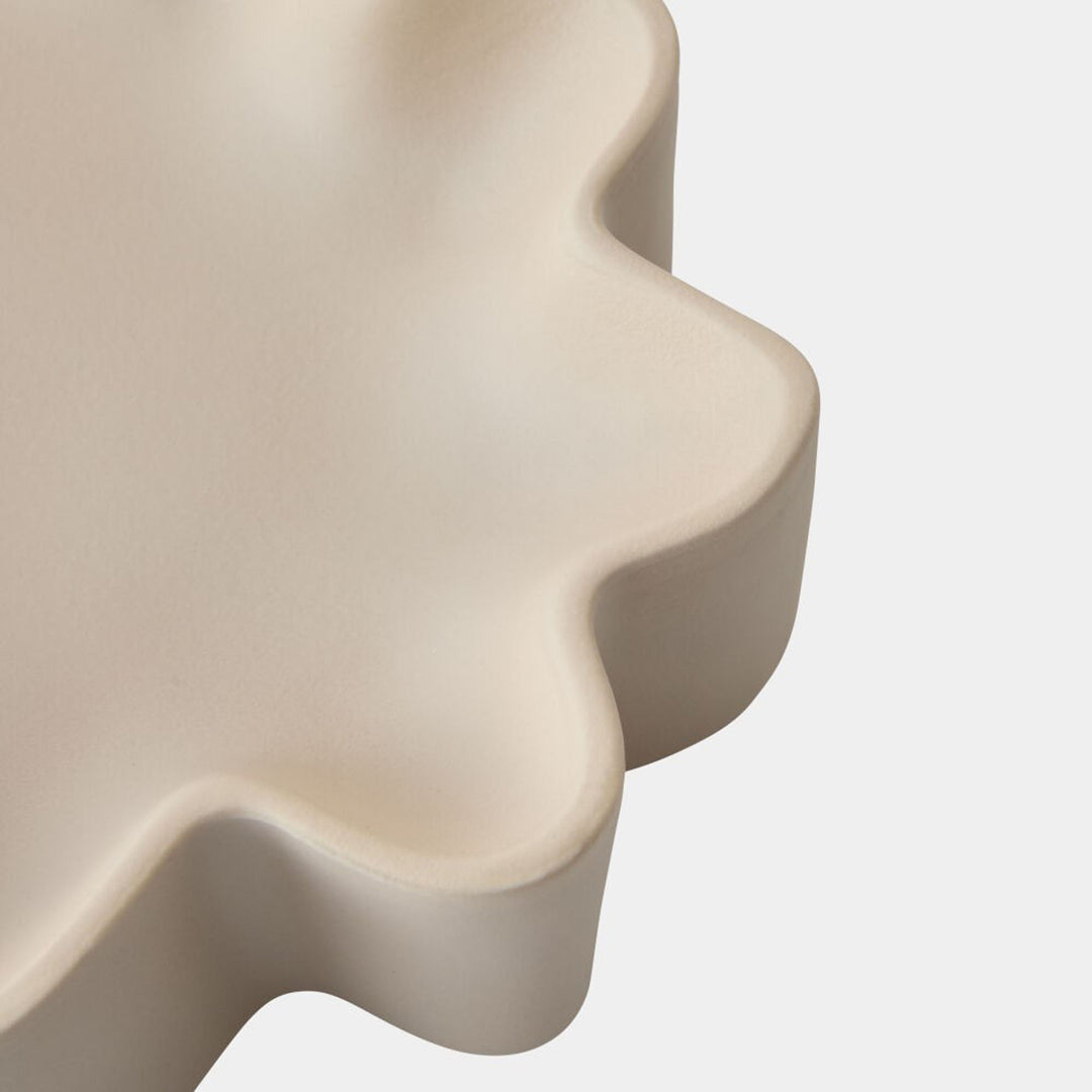 Beige ceramic dish with wavy边缘 on a white background. Decorative Bowl Ochre G by District Home
