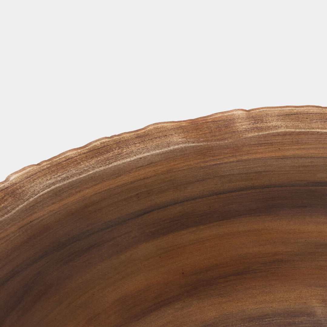 Brown ceramic bowl on a white background. Rhys Footed Bowl by District Home