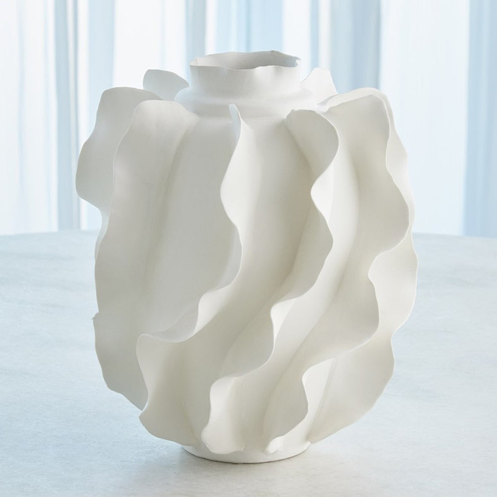 White ceramic vase with wavy design on a white background.Vase Sylvan District Home