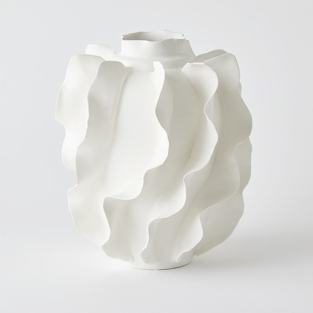 White ceramic vase with wavy design on a white background.Vase Sylvan District Home